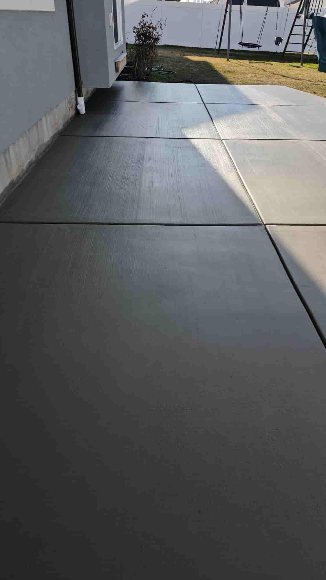 Garage and shop slabs poured flat enough to work on and sloped enough to drain.