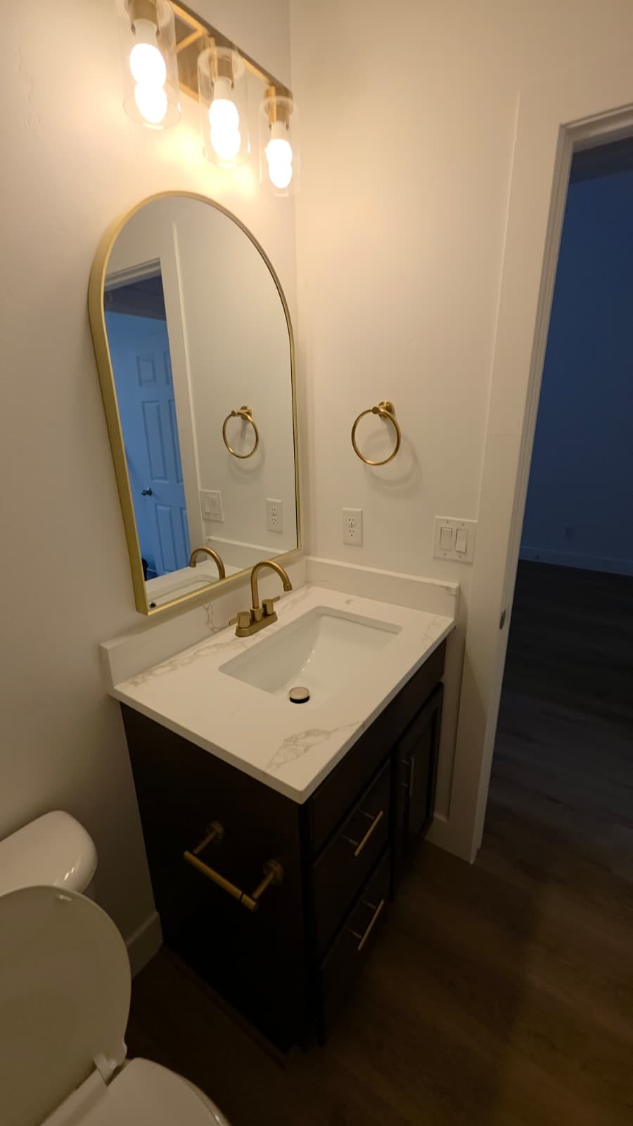Showers waterproofed behind the tile, floors sloped to the drain, and a fan that actually vents outside.